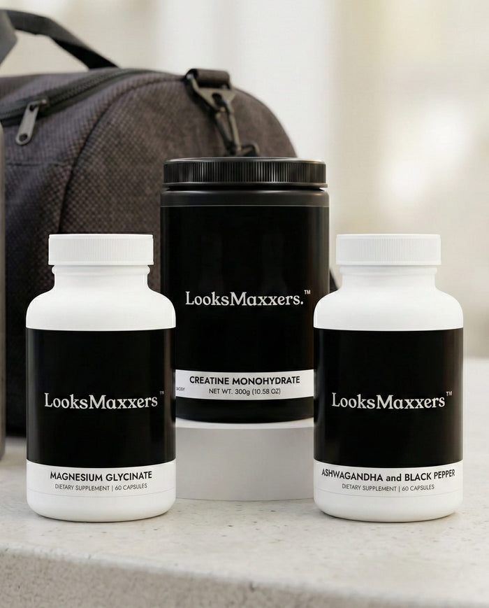 Three supplement bottles labeled 'LooksMaxxers' on a surface with a blurred background.